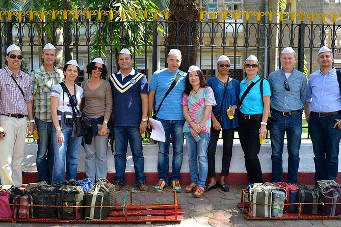 Dabbawala, Dhobi Ghat & Dharavi slum Tour with Local Train Ride - Local train ride: the practical transport that adds context