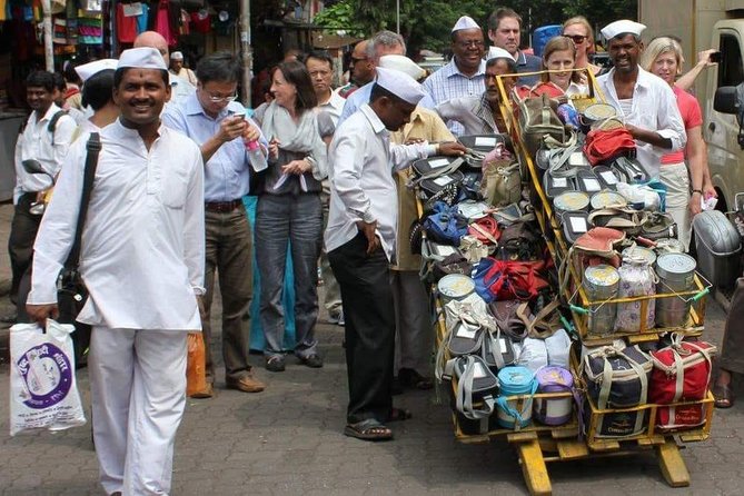 Dabbawala, Dhobi Ghat & Dharavi slum Tour with Local Train Ride - Entering Dharavi: work, services, and everyday streets