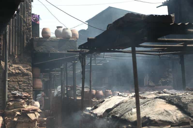 Mumbai: Dharavi Slum 2-Hour Walking Tour - Meeting in Mahim at Café Coffee Day, then following the purple shirt